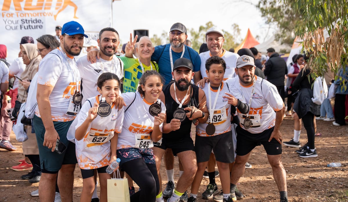 Young participants holding their finisher medals