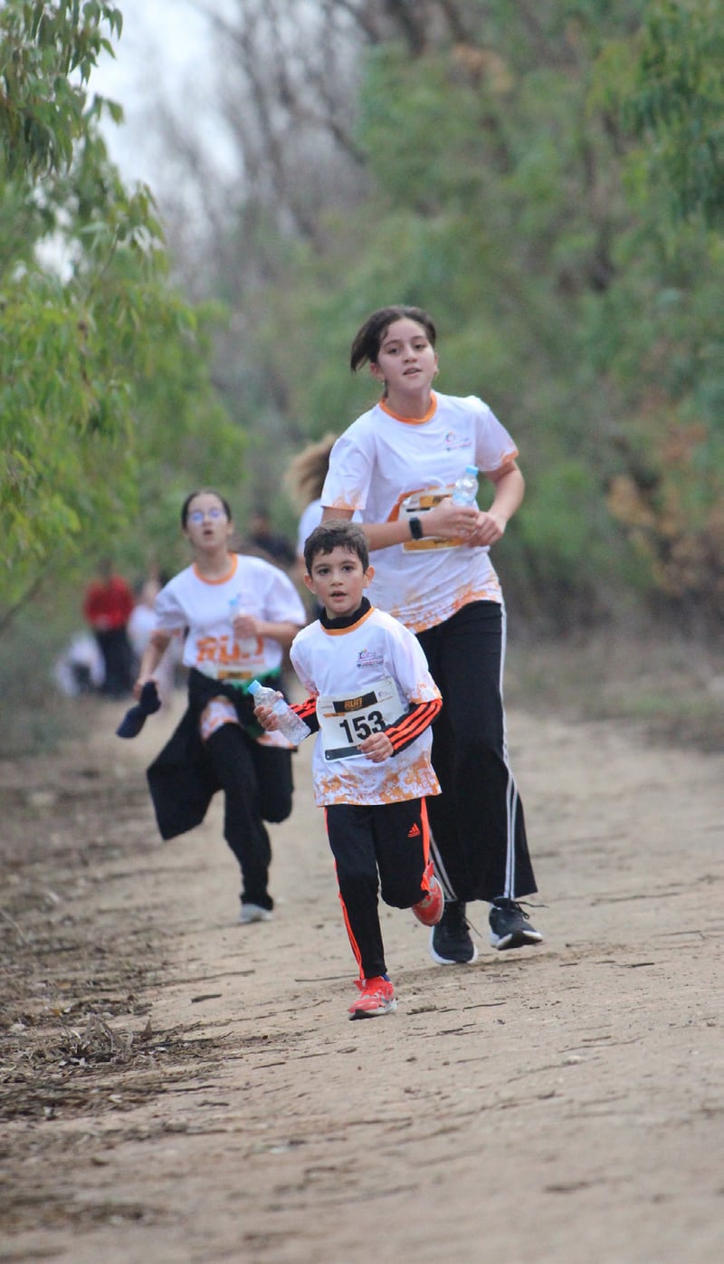 A mother and her child running together at the first edition
